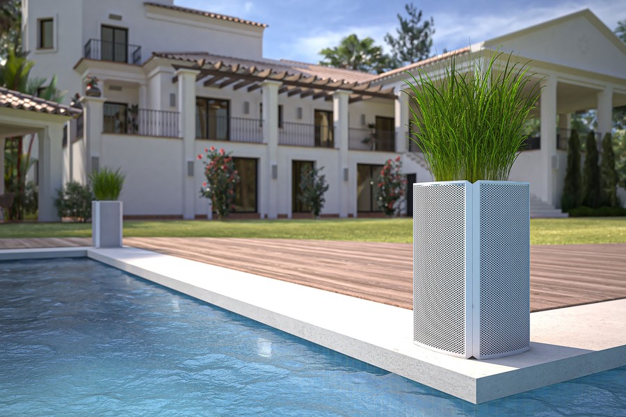 A Razor speaker from Coastal Source doubling as a planter by a pool.