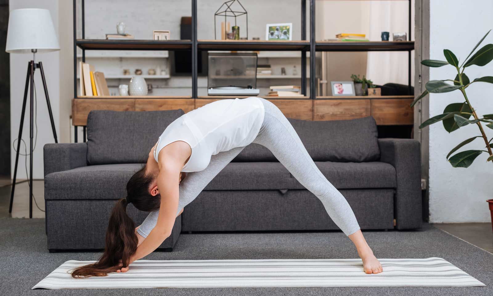Woman Doing Yoga in her living room